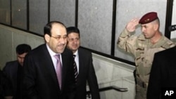 Iraqi Prime Minister Nouri al- Maliki, left, arrives to attend the Iraqi parliament session in Baghdad, Iraq, Monday, Dec. 20, 2010