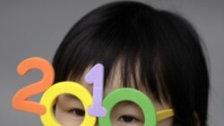 A child wears toy glasses at the Shanghai World Expo in April