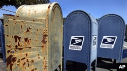 US Postal Service mailboxes are seen awaiting disposal September 1, 2011, in San Jose, California.