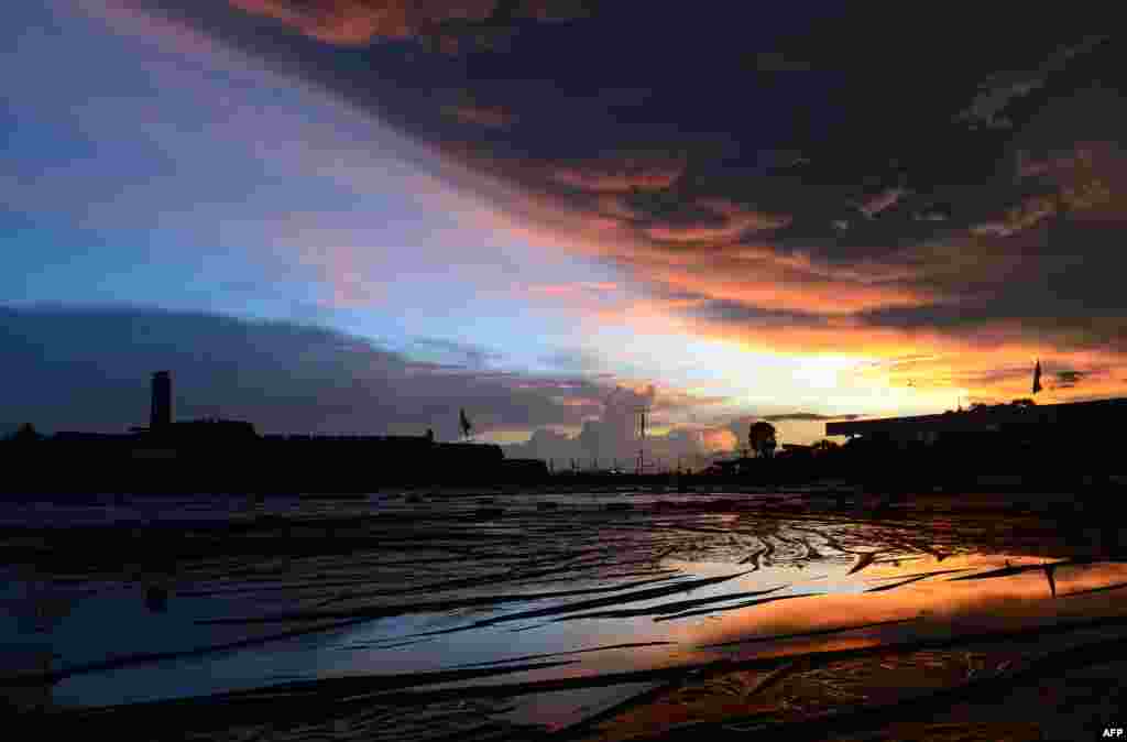 The sun sets behind the 16th-century Dutch fort in Galle, Sri Lanka.