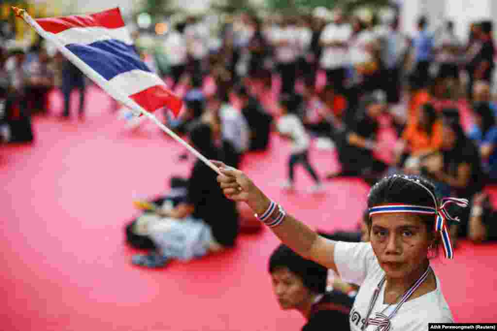 An anti-government protester inside a government complex in Bangkok