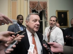 FILE - Sen. Dick Durbin, D-Ill., speaks with reporters in Washington.