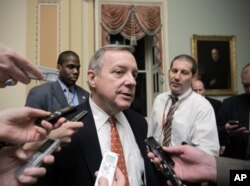 FILE - Sen. Dick Durbin, D-Ill., speaks with reporters in Washington.