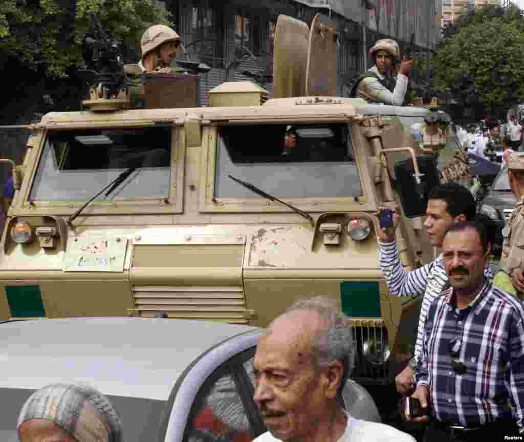 Soldiers stand guard at the site of a bomb blast in Cairo.