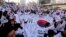 South Koreans give three cheers for the country as they march during a rally to mark the centennial of the March First Independence Movement Day against Japanese colonial rule (1910-45), in Seoul, South Korea, March 1, 2019.