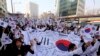 South Koreans give three cheers for the country as they march during a rally to mark the centennial of the March First Independence Movement Day against Japanese colonial rule (1910-45), in Seoul, South Korea, March 1, 2019.