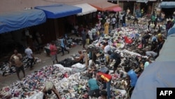 FILE - Traders spread out secondhand clothes for sale at the Kantamanto market in Accra, Ghana, on November 15, 2023.