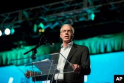 Barrett Duke, chairman of the 2017 Committee on Resolutions, kicks off the vote on nine resolutions at the Southern Baptist Convention annual meeting, June 13, 2017 in Phoenix.