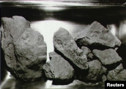 Scientists are studying moon rocks, such as these brought back by Apollo 11 astronauts.