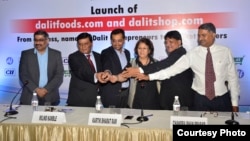 Chandra Bhan Prasad (second from right) at a function to launch Dalit Foods, which he hopes will help to end caste-based discrimination, New Delhi, July 2, 2016. (Courtesy photo from Dalit Foods)