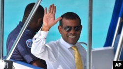 FILE - Maldives former president Mohamed Nasheed as he is taken back to Dhoonidhoo prison after a court dismissed his appeal against his arrest in Male, March 2015.