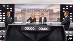 Socialist Party candidate for the presidential election Francois Hollande, left, and current President and conservative candidate for re-election Nicolas Sarkozy , right, pose before a televised debate in Paris, May, 2, 2012. 