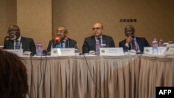Vice President of the Confederation of African Football (CAF) Amaju Pinnink, President of CAF Ahmad Ahmad and Acting general secretary of CAF Essadik Alaoui look on during a press conference after an extraordinary meeting with CAF executives at the Kempin