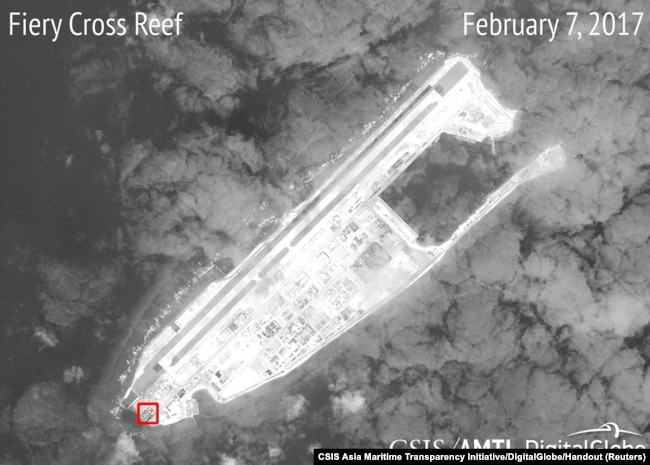 A satellite image shows what CSIS Asia Maritime Transparency Initiative says appears to be concrete structures with retractable roofs on the artificial island Fiery Cross reefs, South China Sea, in this image released on February 22, 2017.
