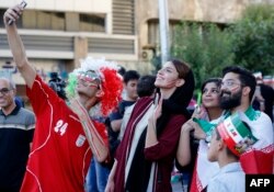 Iranians pose for a selfie before watching the World Cup Group B soccer match between Morocco and Iran at Azadi cinema in Tehran, June 15, 2018.