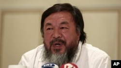 Chinese activist and artist Ai Weiwei addresses journalists during a news conference in Athens, Friday, Jan. 1, 2016. The Chinese artist visited the island of Lesbos is solidarity with refugees and migrants who continue to arrive on a daily basis hoping to make their way into Europe. 