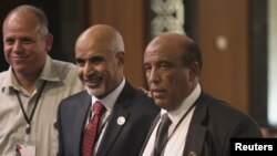 Mohammed Magarif (C) poses for a picture after winning the presidency in the National Congress, at a hotel in Tripoli, August 9, 2012. 