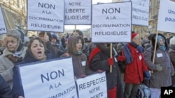 Members of the Church of Scientology, protest outside Paris courthouse in Paris, Feb. 2, 2012.