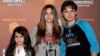 FILE - This Jan. 27, 2012 file photo shows, from left, Blanket Jackson, Paris Jackson, and Prince Michael Jackson at the opening night of the Michael Jackson The Immortal World Tour in Los Angeles.