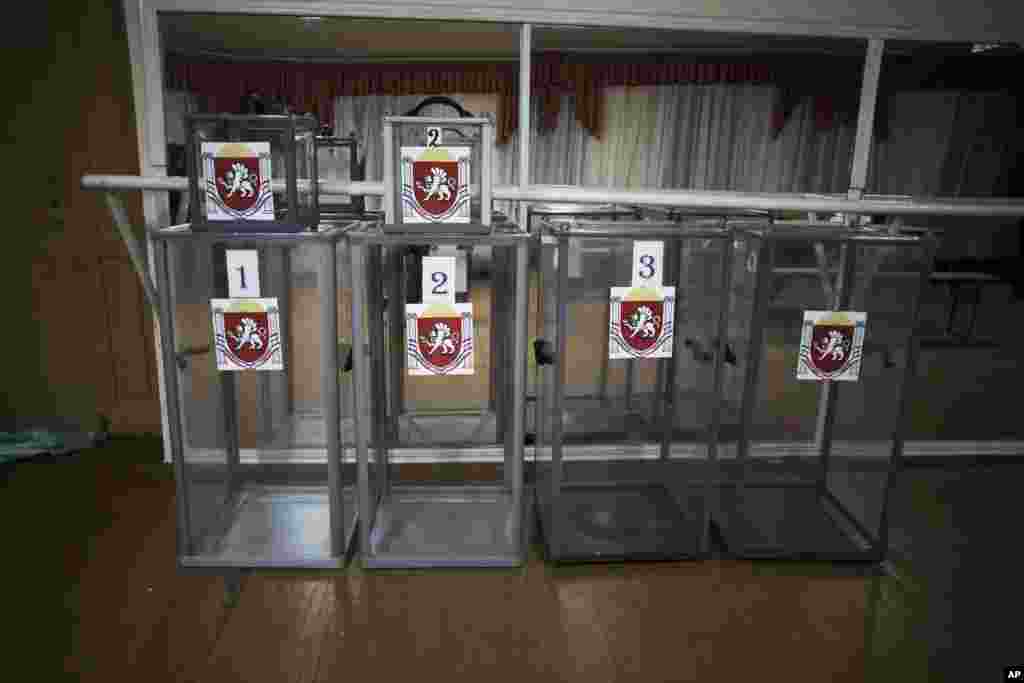 Ballot boxes with the coat of arms of Crimea are seen at a polling station in Dobroe, near Simferopol, Ukraine, March 13, 2014. 