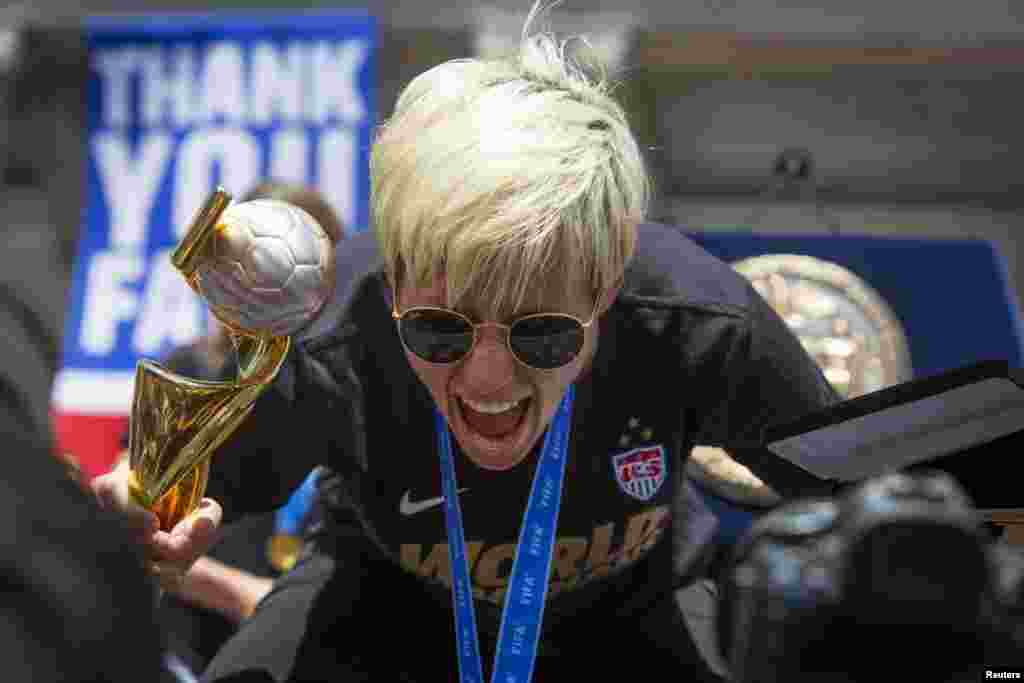 Megan Rapinoe poses for members of the press during a reception at New York City Hall for the U.S. women&#39;s soccer team following their ticker-tape parade to celebrate their World Cup final win on Sunday, in New York, July 10, 2015.