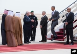 U.S. President Barack Obama is greeted by Ambassador Joseph Westphal, U.S. Ambassador to the Kingdom of Saudi Arabia, as he arrives on Air Force One at King Khalid International Airport in Riyadh, Saudi Arabia, April 20, 2016.