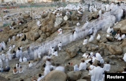 Muslim pilgrims gather on Mount Mercy on the plains of Arafat during the annual haj pilgrimage, outside the holy city of Mecca, Saudi Arabia, Aug. 31, 2017.