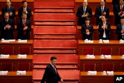 Chinese President Xi Jinping arrives for the opening session of the annual National People's Congress in Beijing's Great Hall of the People, March 5, 2018.