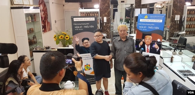 “Trump” and “Kim” meet the press inside the Tuan Duong Hair Salon in Hanoi, Feb. 19, 2019. (Photo - courtesy Tuan Duong)