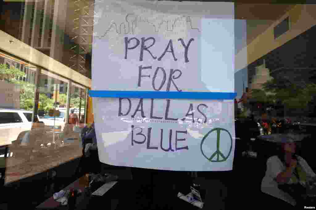 A restaurant posts a sign of support following the multiple police shooting in Dallas, Texas, July 8, 2016.