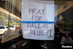 A restaurant posts a sign of support following the multiple police shooting in Dallas, Texas, July 8, 2016.