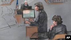In this courtroom sketch, defense attorney Judy Clarke is depicted addressing the jury as defendant Dzhokhar Tsarnaev, right, sits during closing arguments in Tsarnaev's federal death penalty trial, April 6, 2015, in Boston. 