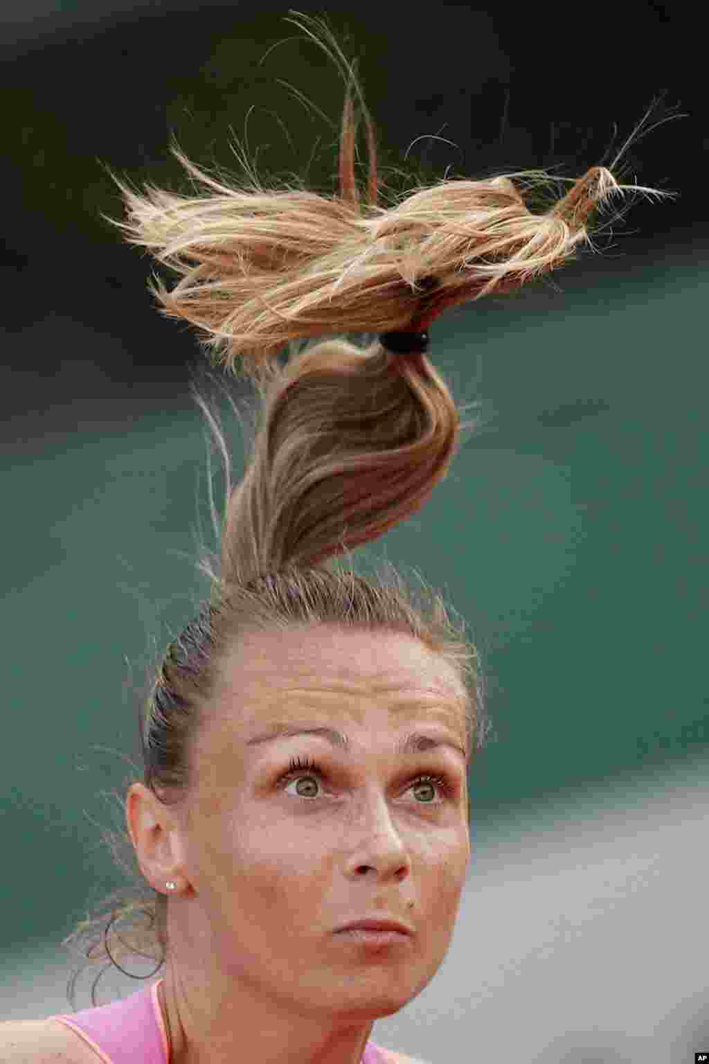 Slovakia&#39;s Magdalena Rybarikova serves against Coco Vandeweghe of the U.S. during their first round match of the French Open tennis tournament at the Roland Garros stadium, in Paris, France.
