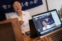 Michiko Kodama, assistant secretary-general of the Japan Confederation of A and H Bomb Sufferers' Organizations, narrates her experience on a livestream of "Kataribe" or story-telling session Sunday, July 12, 2020, in Tokyo. (AP Photo/Eugene Hoshiko)