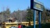 A woman walks onto the campus of the Franklin Regional School District where several people were stabbed at Franklin Regional High School, Murrysville, Pennsylvania, April 9, 2014. 