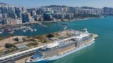 An aerial photo showing the 'Spectrum of the Seas' docked at a terminal in Hong Kong on Jan. 5, 2022, after it was ordered to return to the city for coronavirus testing after 9 people were found to be close contacts with a recent Omicron variant outbreak.