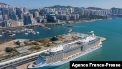 An aerial photo showing the 'Spectrum of the Seas' docked at a terminal in Hong Kong on Jan. 5, 2022, after it was ordered to return to the city for coronavirus testing after 9 people were found to be close contacts with a recent Omicron variant outbreak. 