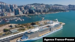 An aerial photo showing the 'Spectrum of the Seas' docked at a terminal in Hong Kong on Jan. 5, 2022, after it was ordered to return to the city for coronavirus testing after 9 people were found to be close contacts with a recent Omicron variant outbreak.