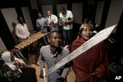 Sudanese Camirata troupe dancers who lost some of their relatives during the conflict in Sudan, Hoda Othman, right, and Kamal perform Al Saysaed dance from East Sudan during a rehearsal in Cairo, Sept.10, 2024.