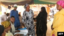 Women prepare to cast their ballots at a polling station in Bamako during the second round of parliamentary elections, Dec. 15, 2013. 