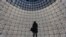 A visitor stands in front of QR-codes information panels during a ceremony to open an information showroom dedicated to the Zaryadye park project in central Moscow, Russia. The showroom, shaped as a dome which houses exhibition halls covered with QR-codes information panels and displaying digital illustration of the project, was opened by Moscow's Mayor Sergei Sobyanin on the site of the future park in a few minutes walk distance from Red Square and the Kremlin, according to organizers.