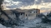 People inspect the damage at the site of an Israeli airstrike that targeted the eastern village of Al-Kayal near Baalbek in the Bekaa valley on Oct. 31, 2024, amid the ongoing war between Israel and Hezbollah. 