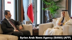 Foreign minister for the interim Syrian government Asaad al-Shaibani (L) meets with Qatar's Prime Minister and Minister of Foreign Affairs Mohammed bin Abdulrahman bin Jassim Al-Thani in Doha, Jan. 5, 2025. 