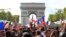  France fans react on the Champs-Elysees avenue during their World Cup final 
