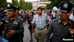 FILE - Anti-junta activist Sirawith Seritiwat (C) takes part in a demonstration asking for the release of his mother Patnaree Chankij, in Bangkok, Thailand on May 7, 2016.