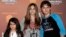 FILE - This Jan. 27, 2012 file photo shows, from left, Blanket Jackson, Paris Jackson, and Prince Michael Jackson at the opening night of the Michael Jackson The Immortal World Tour in Los Angeles.