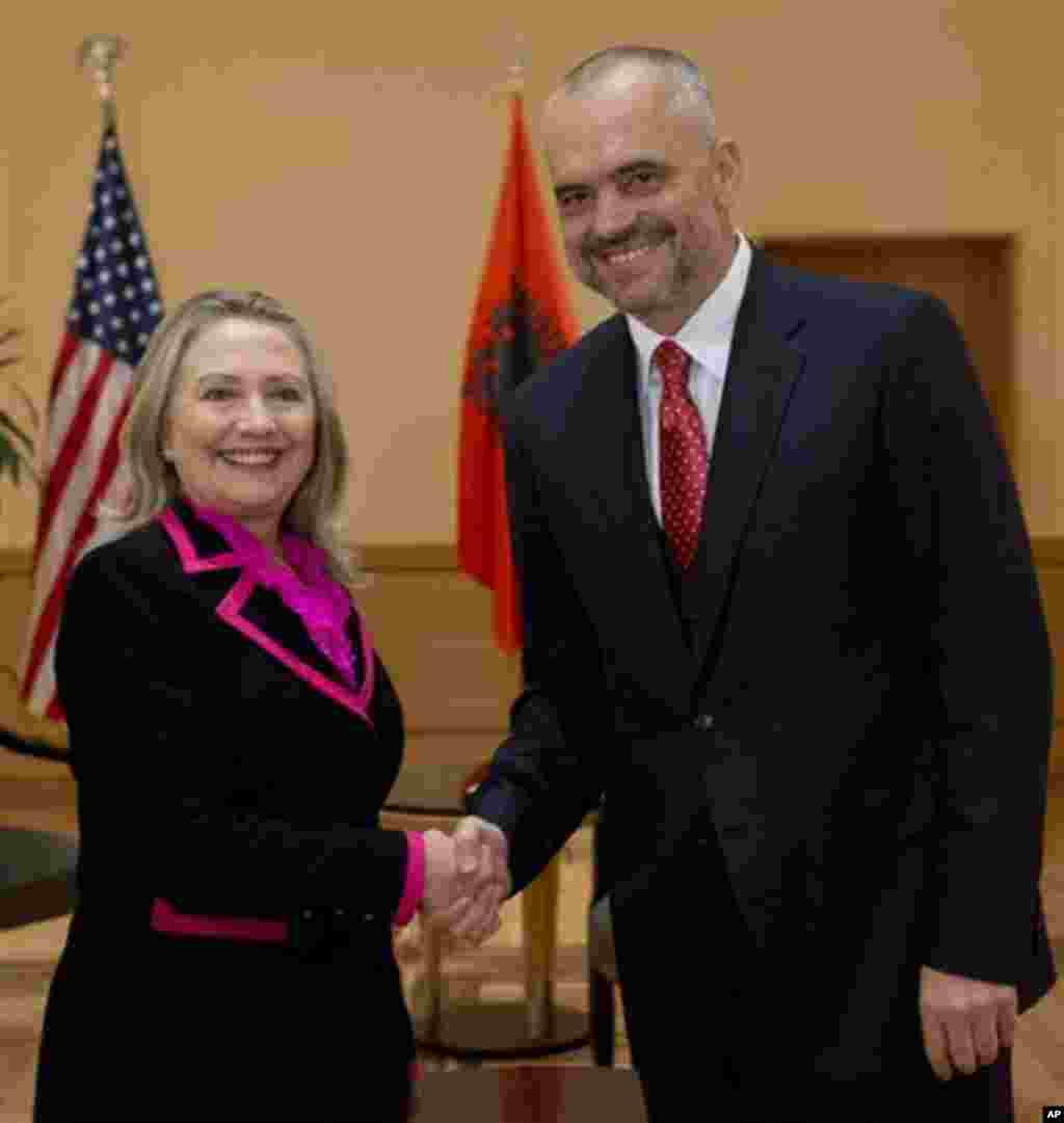 US Secretary of State Hillary Clinton shakes hands with Albanian Socialist Party Chief Edi Rama prior to a meeting in Tirana, Albania, Thursday, Nov. 1, 2012. Hillary Clinton arrived in EU-hopeful Albania on the last leg of her Balkans tour where she is e