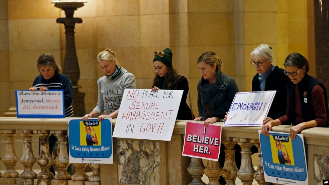 FILE - Women rally at the State Capitol in St. Paul, Minnesota, in response to a tide of sexual harassment allegations, Nov. 17, 2017.