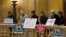 FILE - Women rally at the State Capitol in St. Paul, Minnesota, in response to a tide of sexual harassment allegations, Nov. 17, 2017.