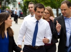 Democratic presidential candidate Mayor Pete Buttigieg walks to his car after attending a rally, protesting President Donald Trump policies outside the White House in Washington, June 12, 2019.